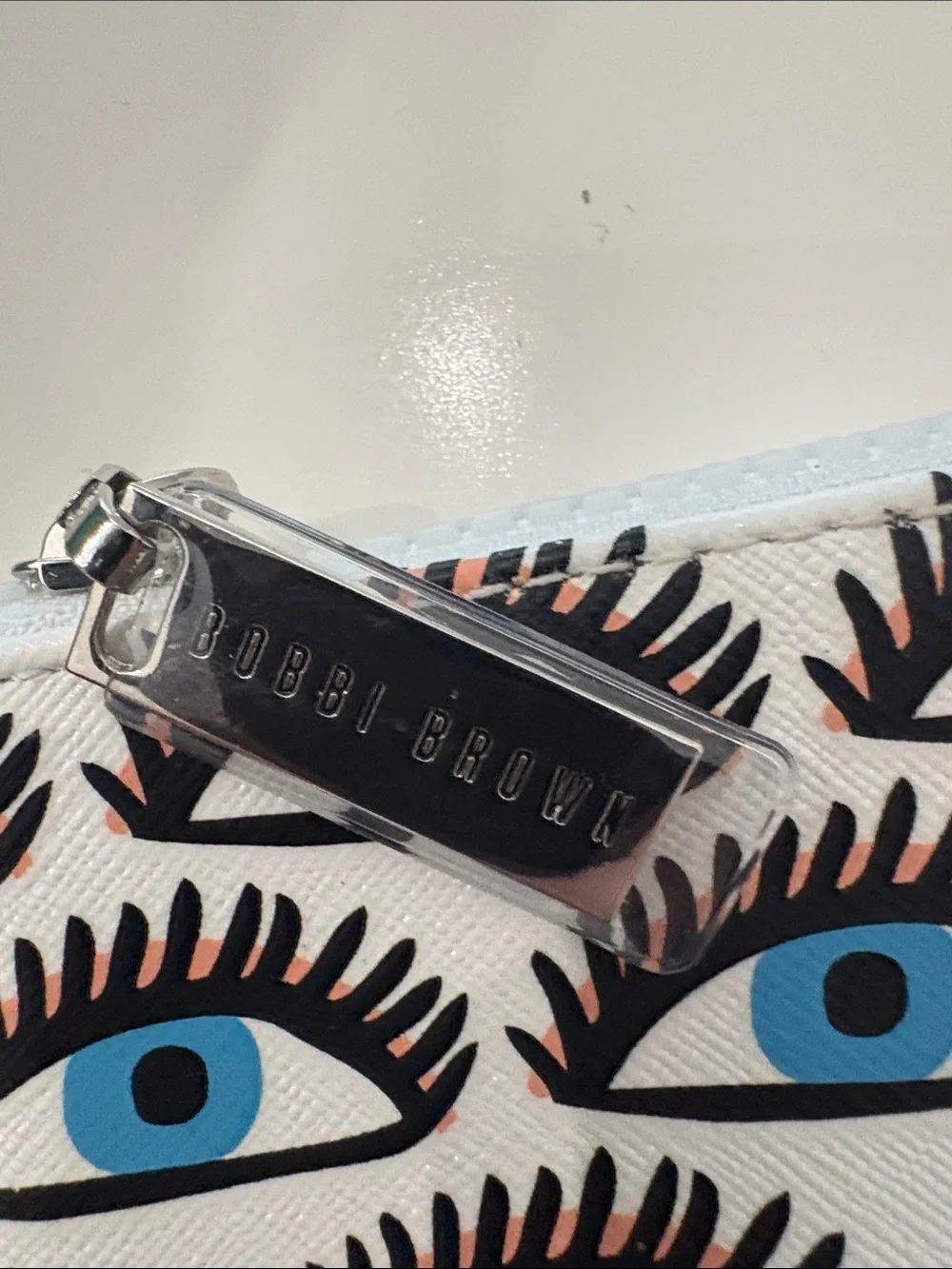 Bobbi Brown Blue Eye Print Zip Pouch in White, Black and Blue